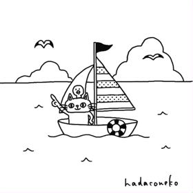 海の日にヨットで冒険してる猫の画像