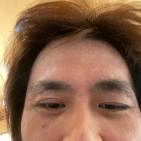 半目笑い悪ばれの画像